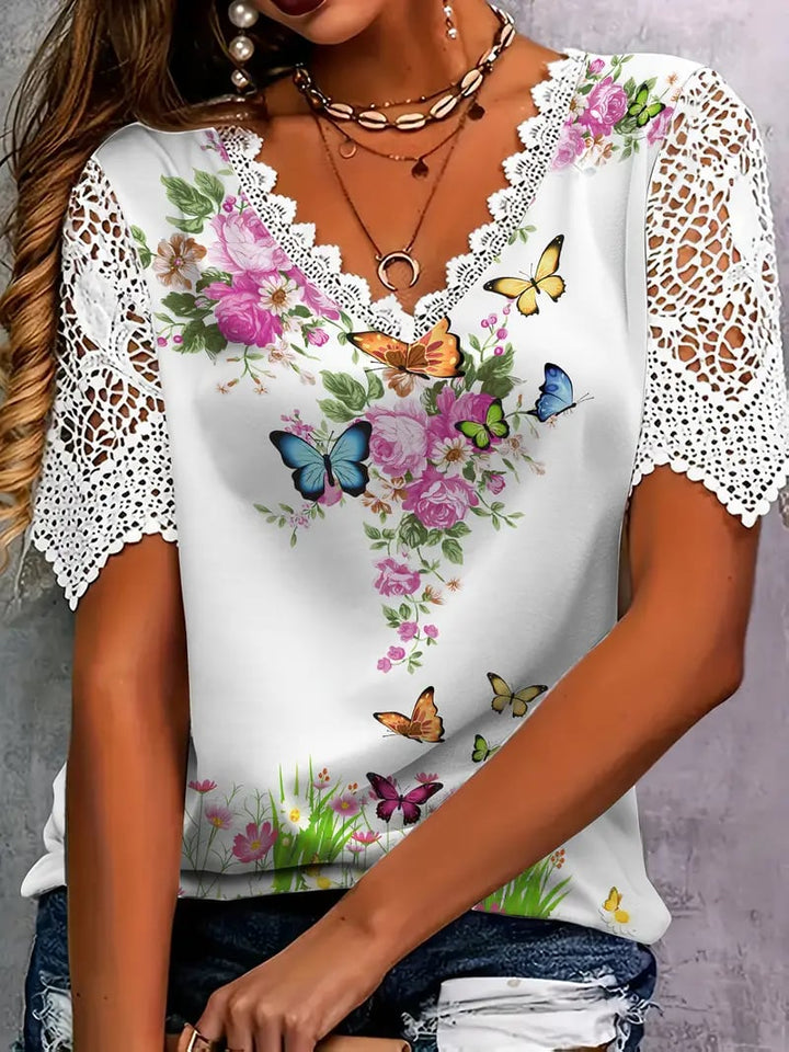 Erika | Elegantní top s krajkovým zakončením a květinovým vzorem motýla